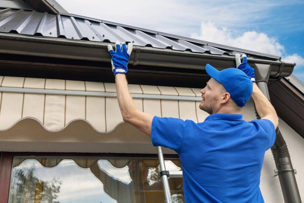 Man installing gutter