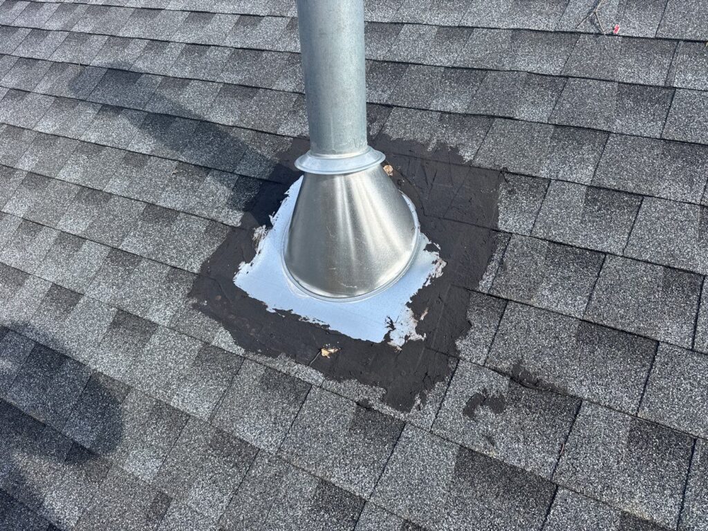 HVAC vent penetration on new construction home in Florham Park NJ sealed with roof cement around the perimeter instead of integrated flashing under shingle courses